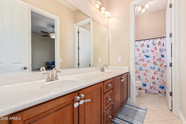 bathroom featuring curtained shower, vanity, ceiling fan, toilet, and tile patterned floors