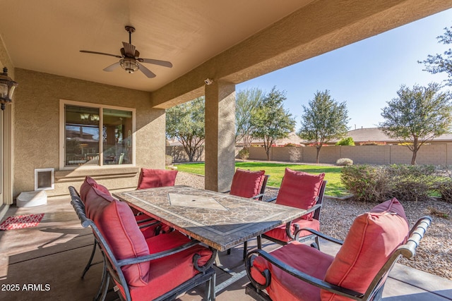 view of patio featuring ceiling fan