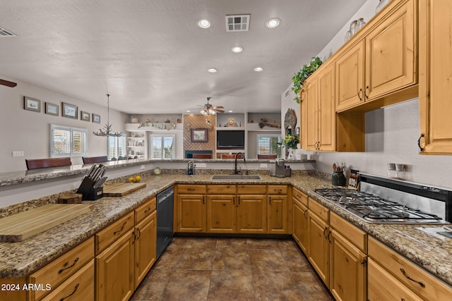 kitchen with black dishwasher, light stone countertops, sink, and kitchen peninsula