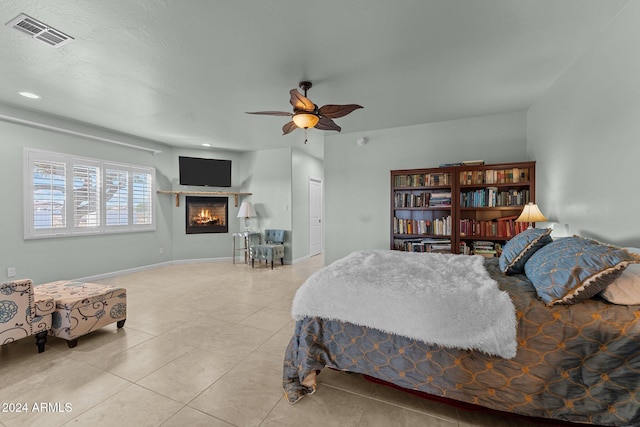 bedroom with light tile patterned flooring and ceiling fan