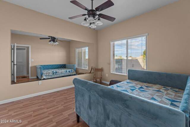 bedroom featuring hardwood / wood-style flooring and ceiling fan