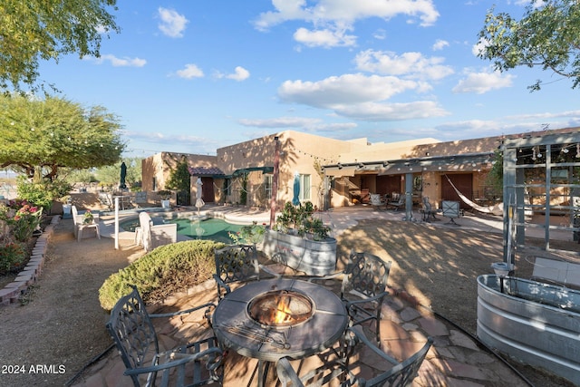 view of patio / terrace with an outdoor fire pit