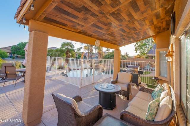 view of patio with an outdoor living space and a grill