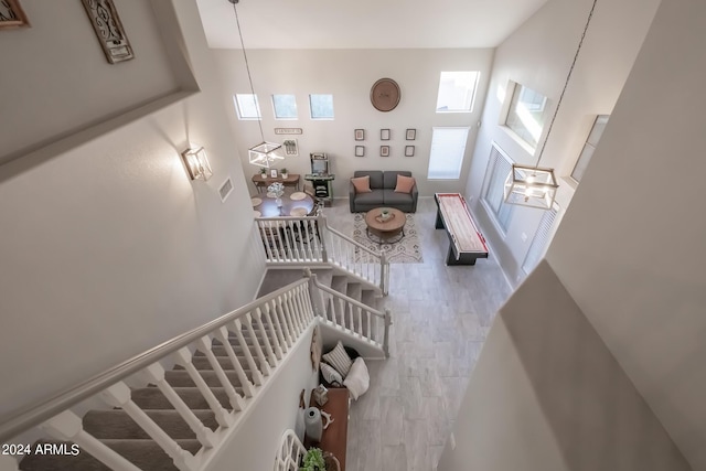 staircase with a high ceiling