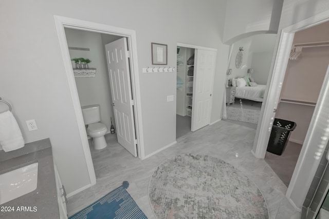 bathroom with toilet and vanity