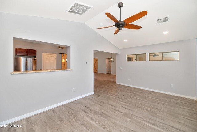 6457 E Encanto St, Mesa, AZ 85205 - unfurnished living room featuring a ceiling fan, baseboards, visible vents, and vaulted ceiling