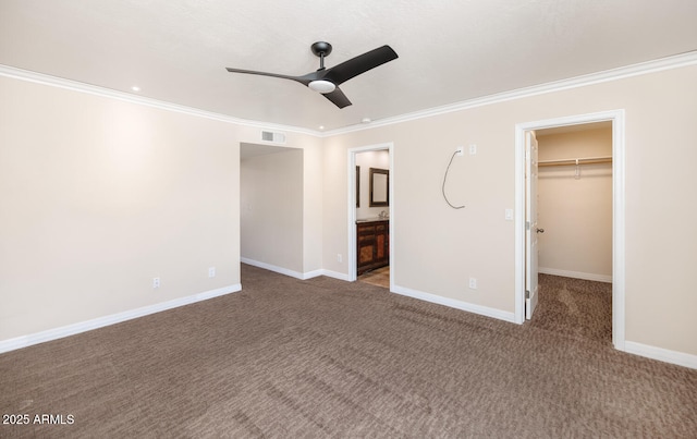 6457 E Encanto St, Mesa, AZ 85205 - unfurnished bedroom featuring visible vents, crown molding, carpet floors, a walk in closet, and baseboards