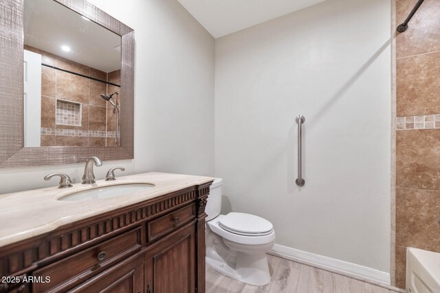 6457 E Encanto St, Mesa, AZ 85205 - bathroom with toilet, wood finished floors, vanity, shower / bath combination, and baseboards