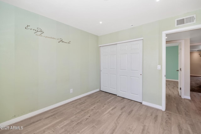 6457 E Encanto St, Mesa, AZ 85205 - unfurnished bedroom featuring a closet, wood finished floors, visible vents, recessed lighting, and baseboards