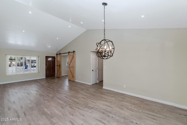 6457 E Encanto St, Mesa, AZ 85205 - unfurnished living room featuring light wood-style flooring, a barn door, baseboards, a chandelier, and high vaulted ceiling