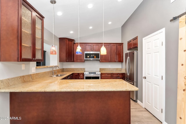 6457 E Encanto St, Mesa, AZ 85205 - kitchen with a sink, a peninsula, appliances with stainless steel finishes, glass insert cabinets, and light wood-style floors