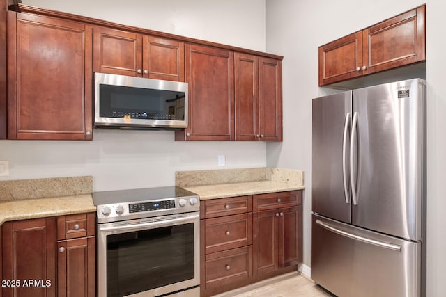 6457 E Encanto St, Mesa, AZ 85205 - kitchen with light stone countertops and appliances with stainless steel finishes