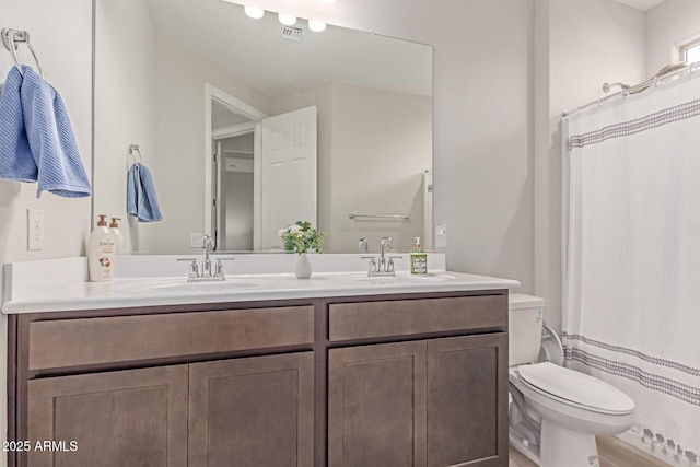 2881 N Riverside Dr, Florence, AZ 85132 - bathroom with toilet, double vanity, and a shower with curtain