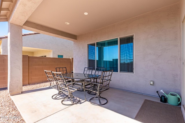 2881 N Riverside Dr, Florence, AZ 85132 - view of patio / terrace featuring outdoor dining space and fence