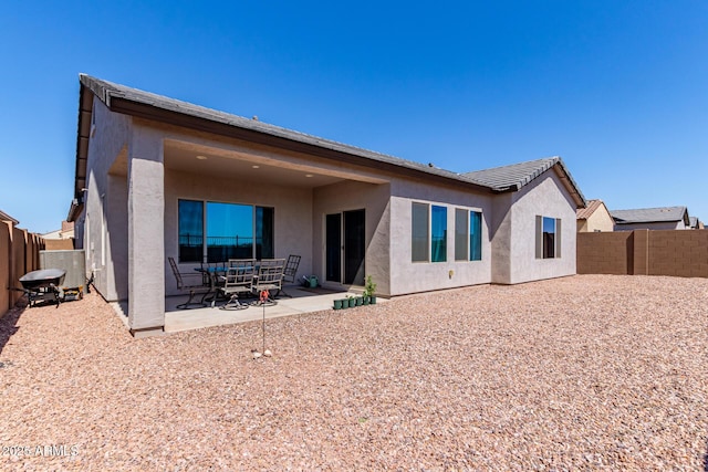 2881 N Riverside Dr, Florence, AZ 85132 - rear view of property with stucco siding, a patio, and a fenced backyard