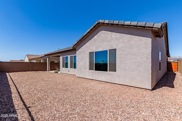 2881 N Riverside Dr, Florence, AZ 85132 - back of property featuring a fenced backyard and stucco siding