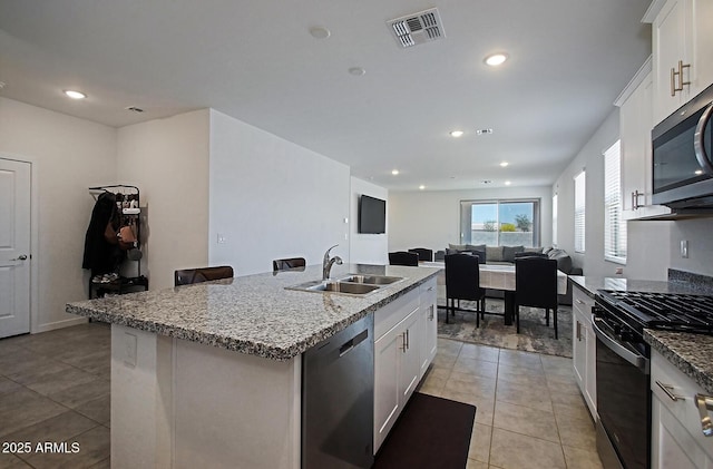 41600 W Dusty Creek Dr, Maricopa, AZ 85138 - kitchen with a sink, light tile patterned floors, visible vents, and appliances with stainless steel finishes