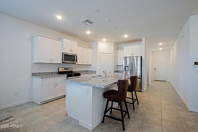 41600 W Dusty Creek Dr, Maricopa, AZ 85138 - kitchen with a sink, visible vents, light tile patterned floors, and stainless steel appliances