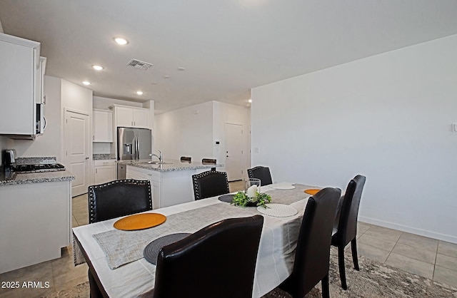 41600 W Dusty Creek Dr, Maricopa, AZ 85138 - dining space featuring light tile patterned floors, recessed lighting, visible vents, and baseboards