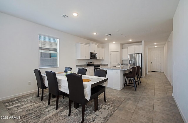 41600 W Dusty Creek Dr, Maricopa, AZ 85138 - dining space with baseboards, recessed lighting, light tile patterned floors, and visible vents