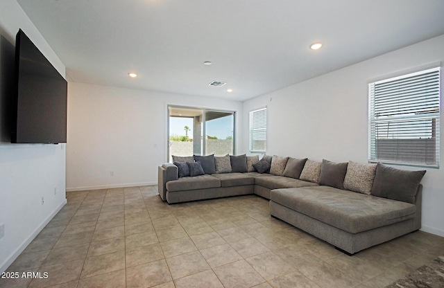 41600 W Dusty Creek Dr, Maricopa, AZ 85138 - living room featuring light tile patterned floors, recessed lighting, visible vents, and baseboards