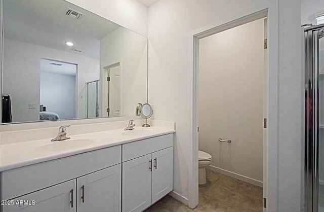 41600 W Dusty Creek Dr, Maricopa, AZ 85138 - bathroom with double vanity, visible vents, toilet, and a sink