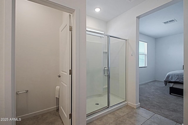 41600 W Dusty Creek Dr, Maricopa, AZ 85138 - full bathroom with a shower stall, visible vents, baseboards, ensuite bath, and tile patterned flooring