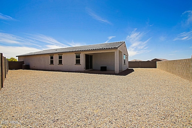 41600 W Dusty Creek Dr, Maricopa, AZ 85138 - back of property featuring stucco siding, a patio area, and a fenced backyard