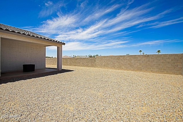 41600 W Dusty Creek Dr, Maricopa, AZ 85138 - view of yard featuring a fenced backyard and a patio area