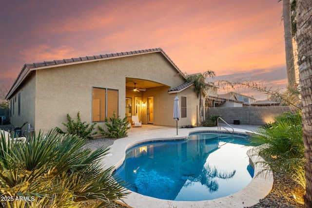 view of pool with a ceiling fan, a fenced in pool, a patio, and fence