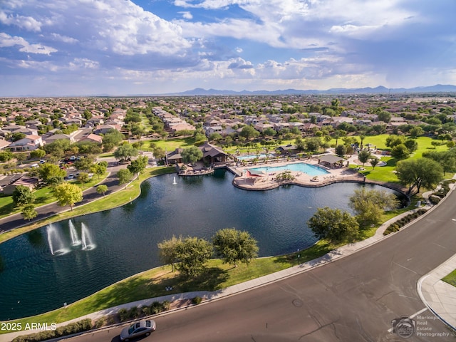 bird's eye view featuring a water and mountain view