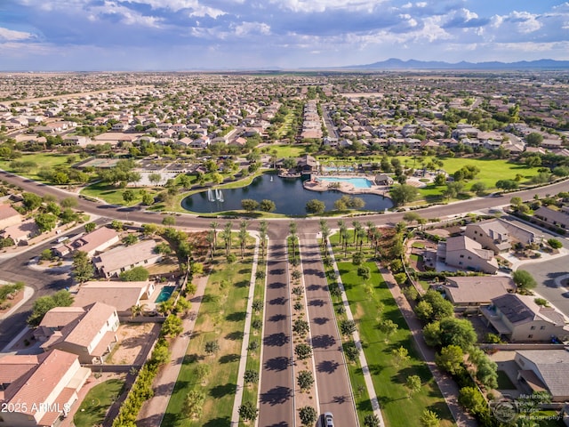 aerial view featuring a water and mountain view and a residential view