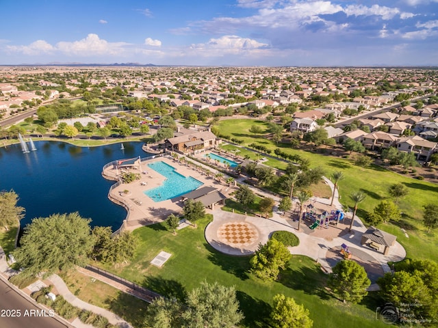 bird's eye view featuring a water view and a residential view