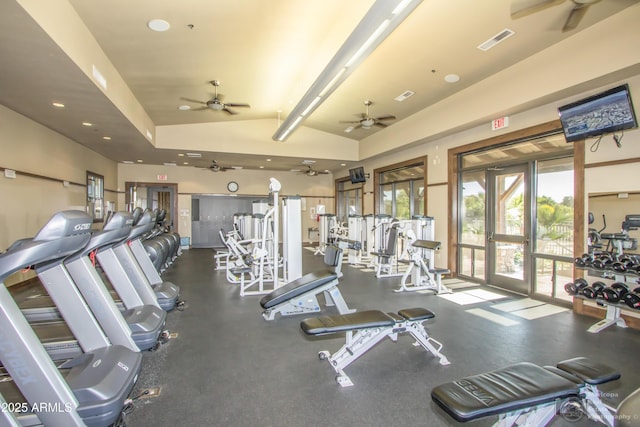 exercise room featuring visible vents, vaulted ceiling, and french doors