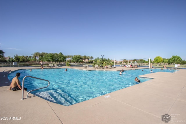 community pool featuring a patio area