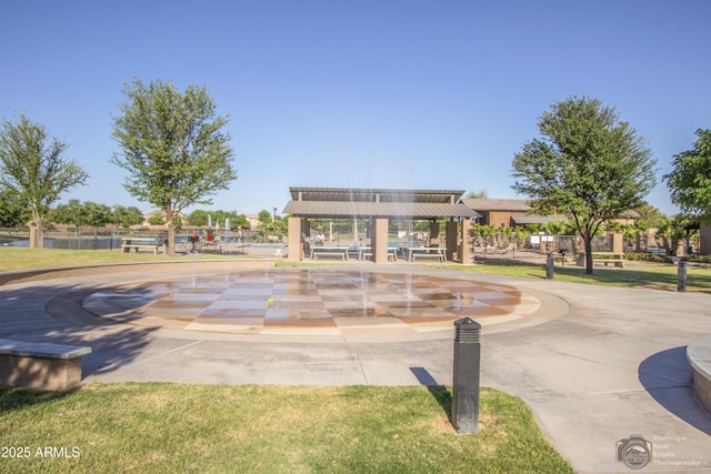 view of property's community featuring a yard