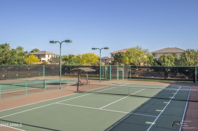 view of sport court featuring community basketball court and fence