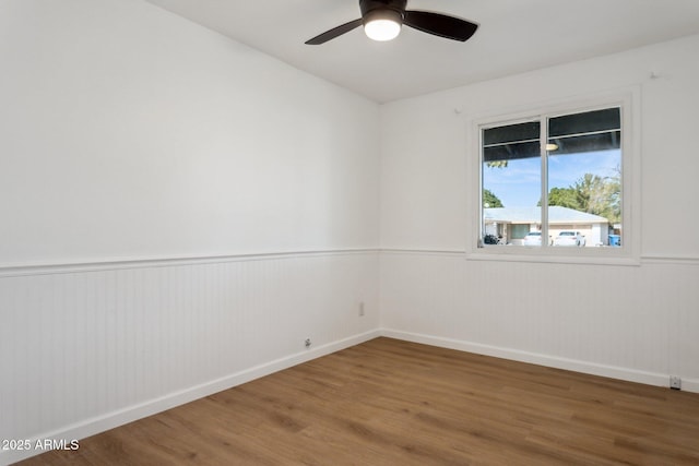 empty room with wood-type flooring and ceiling fan