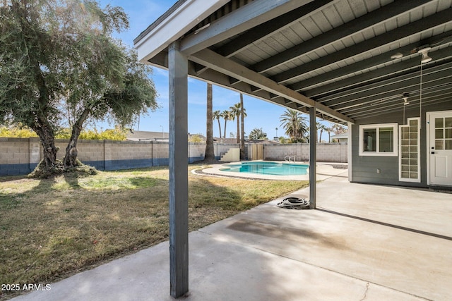 view of patio / terrace with a fenced in pool