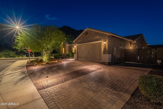 10207 W Hedge Hog Pl, Peoria, AZ 85383 - single story home with an attached garage, decorative driveway, and stucco siding