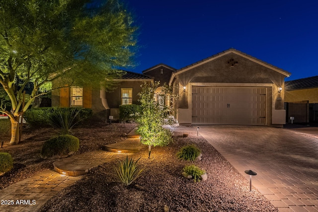 10207 W Hedge Hog Pl, Peoria, AZ 85383 - ranch-style house featuring stucco siding, an attached garage, decorative driveway, and a tile roof