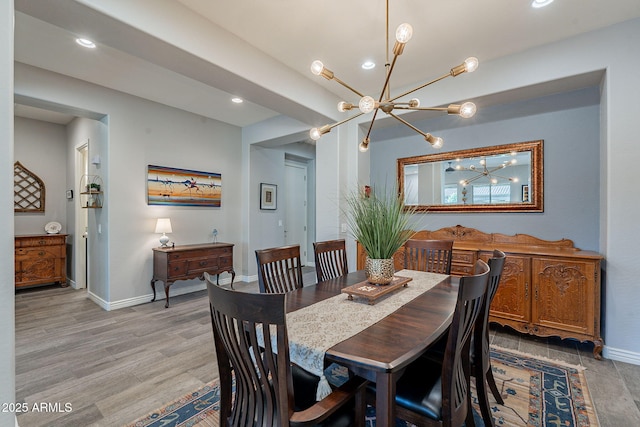 10207 W Hedge Hog Pl, Peoria, AZ 85383 - dining room with a chandelier, baseboards, recessed lighting, and light wood-style floors