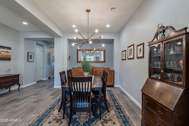 10207 W Hedge Hog Pl, Peoria, AZ 85383 - dining space featuring a chandelier, dark wood-style floors, baseboards, and recessed lighting