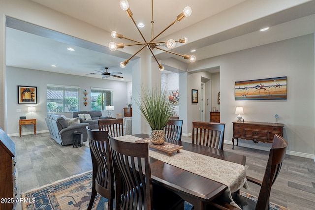 10207 W Hedge Hog Pl, Peoria, AZ 85383 - dining room with a chandelier, wood finished floors, baseboards, recessed lighting, and a ceiling fan