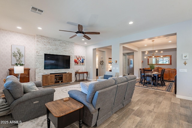 10207 W Hedge Hog Pl, Peoria, AZ 85383 - living room featuring light wood-style flooring, a chandelier, ceiling fan, baseboards, and recessed lighting