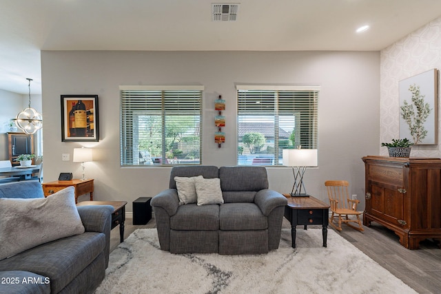 10207 W Hedge Hog Pl, Peoria, AZ 85383 - living room featuring plenty of natural light, wood finished floors, recessed lighting, and baseboards