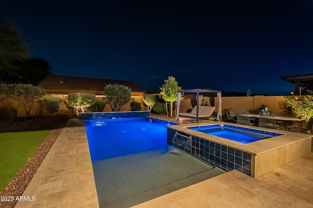 10207 W Hedge Hog Pl, Peoria, AZ 85383 - pool at night with an in-ground hot tub, a patio, a fenced backyard, and a gazebo