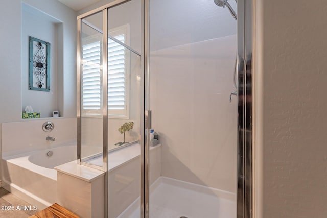 10207 W Hedge Hog Pl, Peoria, AZ 85383 - bathroom featuring a garden tub, a shower stall, and a textured wall