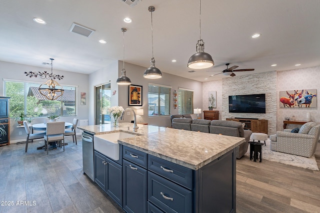 10207 W Hedge Hog Pl, Peoria, AZ 85383 - kitchen with a sink, dark wood-type flooring, dishwasher, ceiling fan, and a center island with sink
