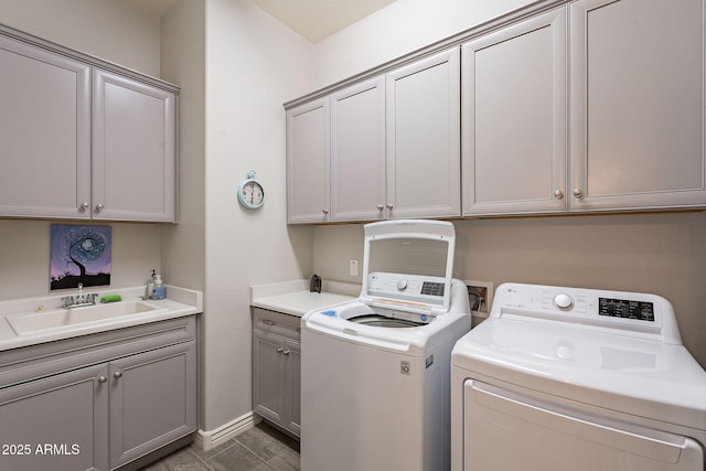 10207 W Hedge Hog Pl, Peoria, AZ 85383 - laundry room featuring cabinet space, washing machine and dryer, and baseboards